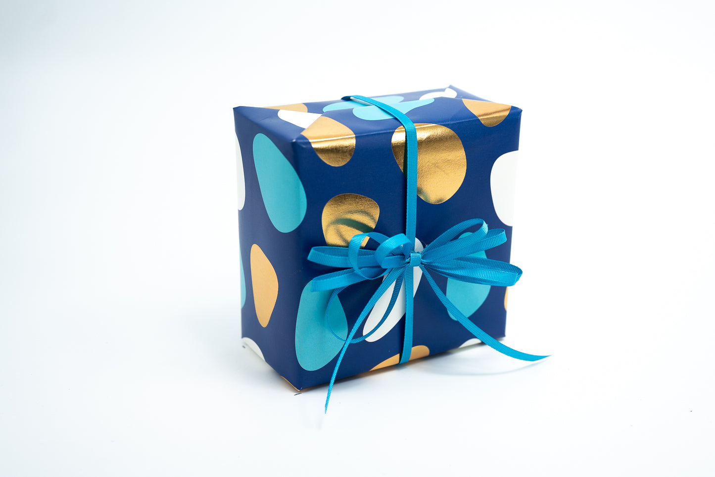 PEBBLES PRINT WRAPPING PAPER IN TURQUOISE AND GOLD