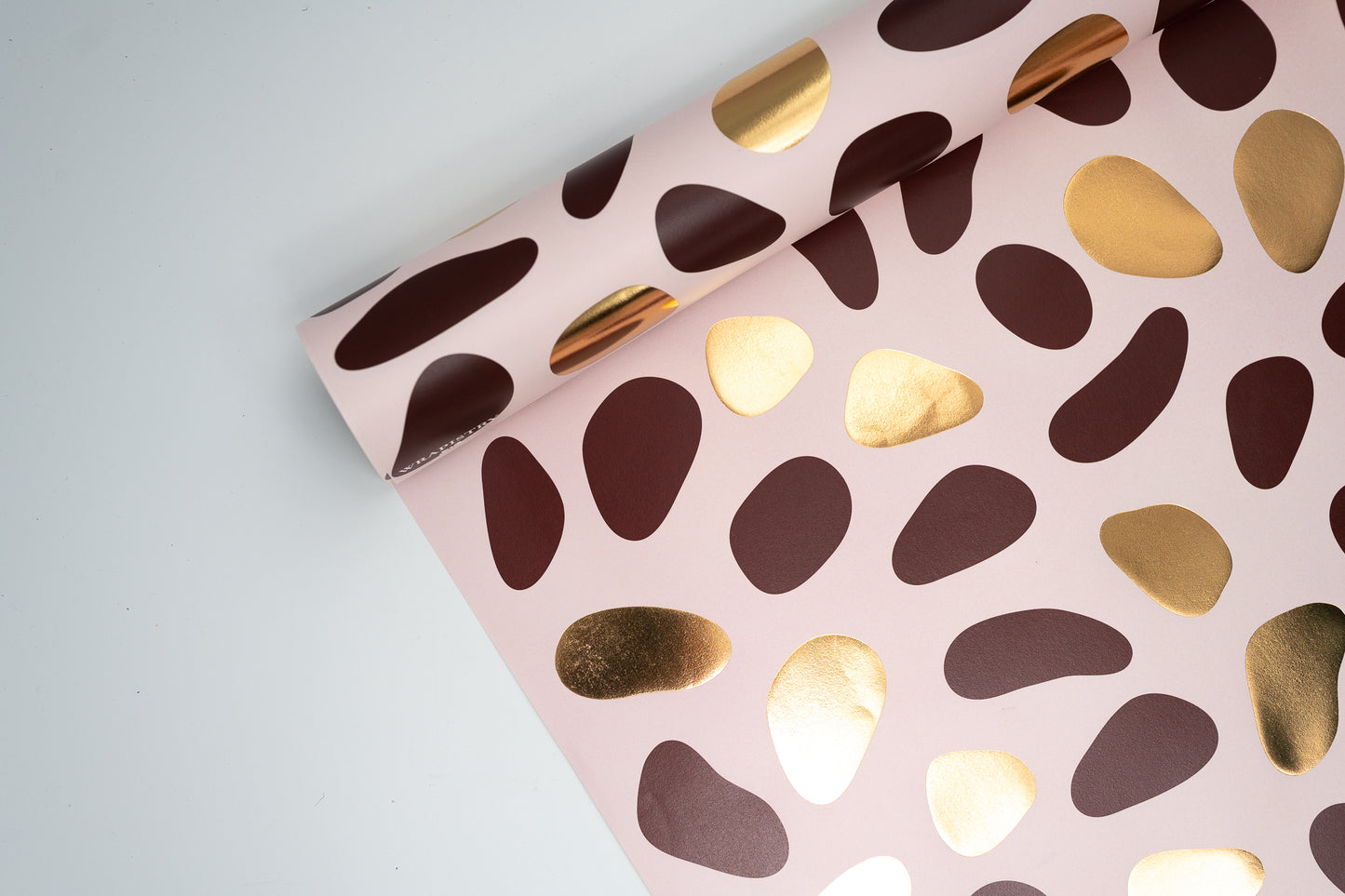 PEBBLES GIFT WRAPPING PAPER IN PINK, BROWN AND GOLD