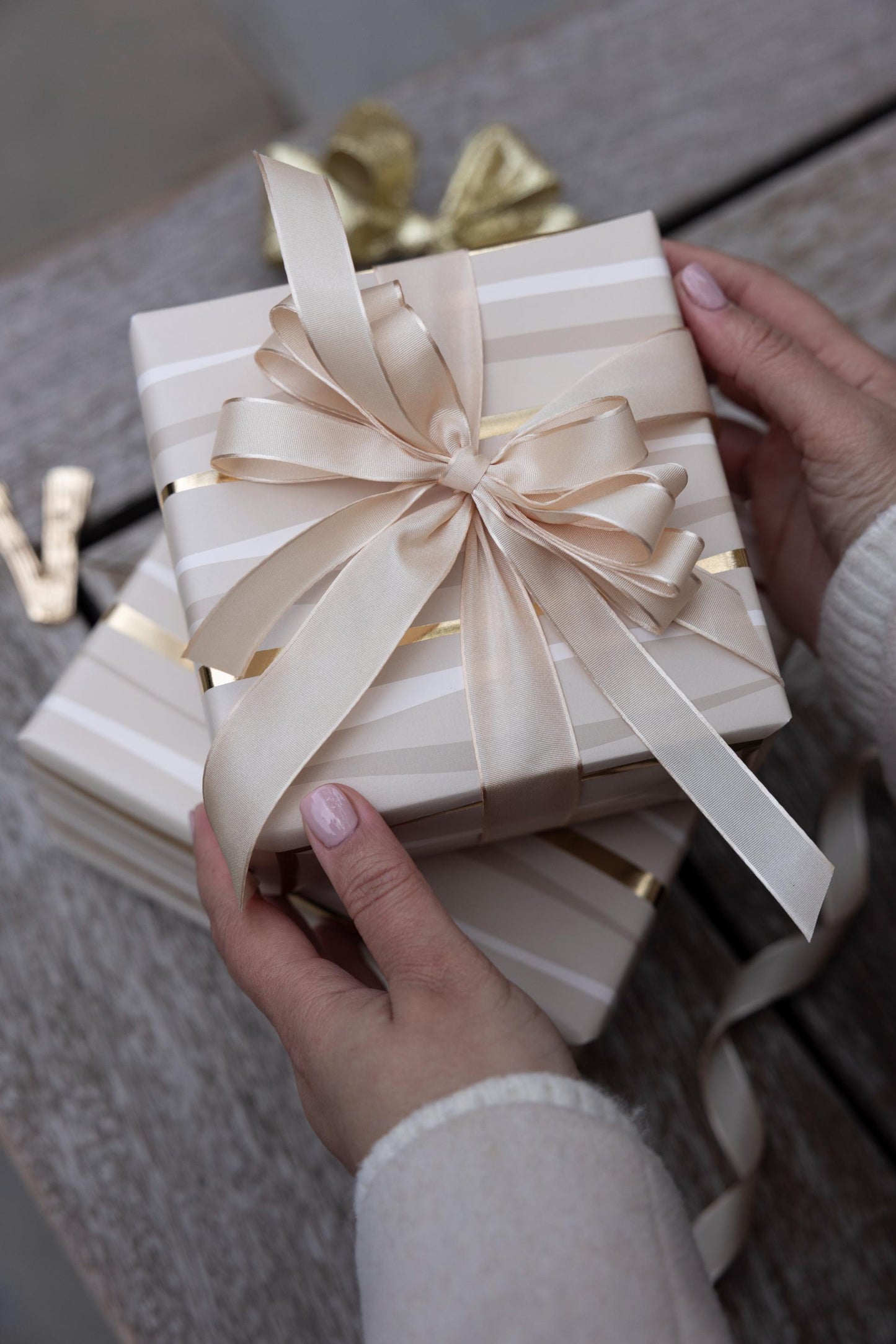 Festive Wave Print Wrapping Paper in Beige and Gold