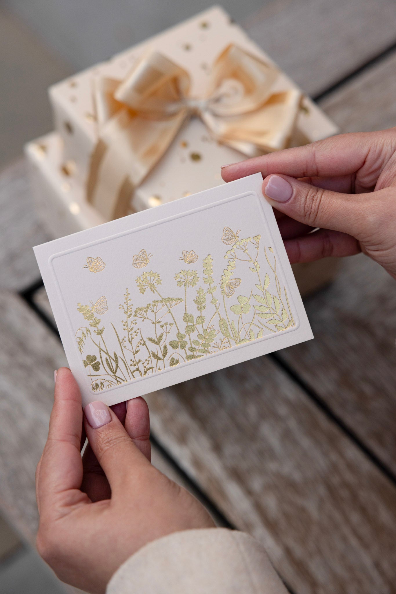Butterfly Lane with gold accents on a beige card stock