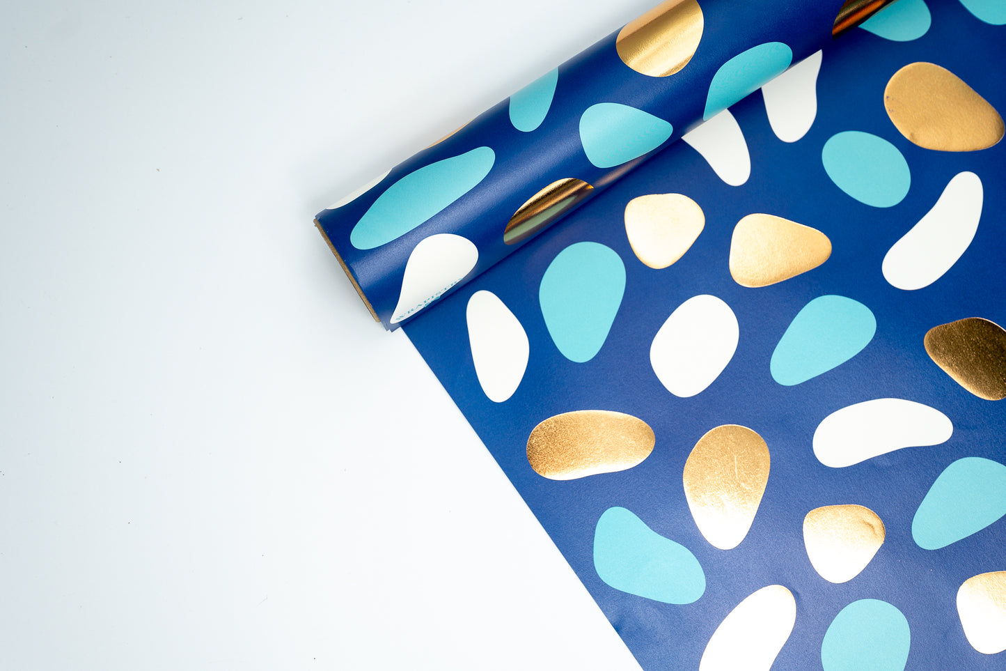PEBBLES PRINT WRAPPING PAPER IN TURQUOISE AND GOLD